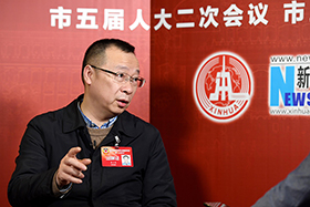 易小光接受新华网专访